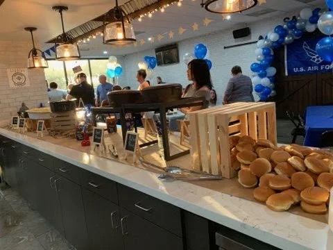 Elegant wedding reception buffet setup by Tony + Co Catering Jacksonville featuring gourmet appetizers and cocktail station
