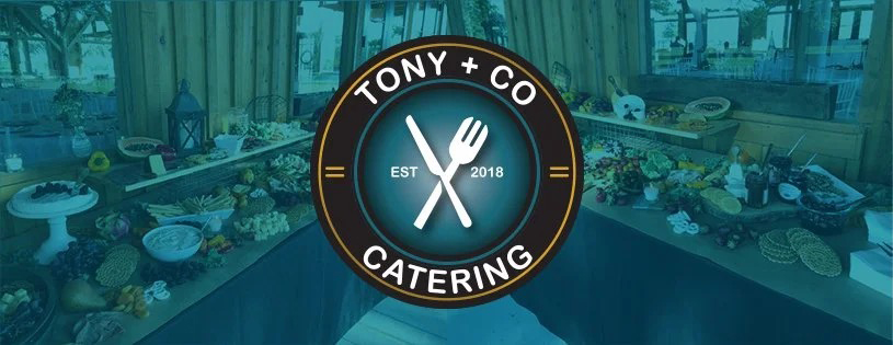 Professional catering buffet setup by Tony + Co Catering showcasing elegant food displays for Jacksonville wedding reception